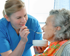 Nurse Feeding an Elderly Lady - Senior Companionship Opelika, AL